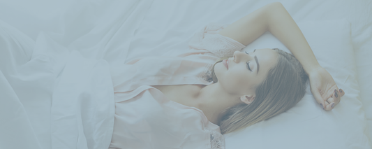 Woman lying on a bed with a blurred background