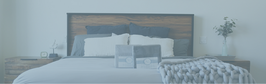 Bedroom with a wooden headboard and light gray Sweet Sheets Canadian bedding